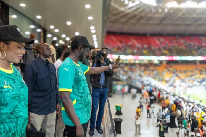 le-president-Diomaye-au-Stade-Abdoulaye-Wade-lors-du-match-des-Lions